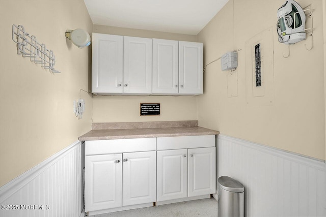 153 Lloyd Rd, Matawan, NJ 07747 - laundry room with a wainscoted wall and a decorative wall