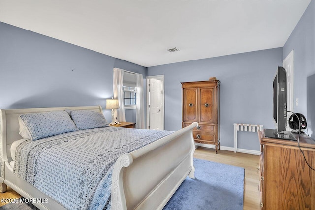 153 Lloyd Rd, Matawan, NJ 07747 - bedroom with light wood-style flooring and baseboards