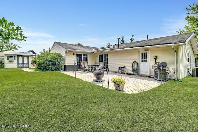153 Lloyd Rd, Matawan, NJ 07747 - back of property featuring a patio area, a shed, and a lawn