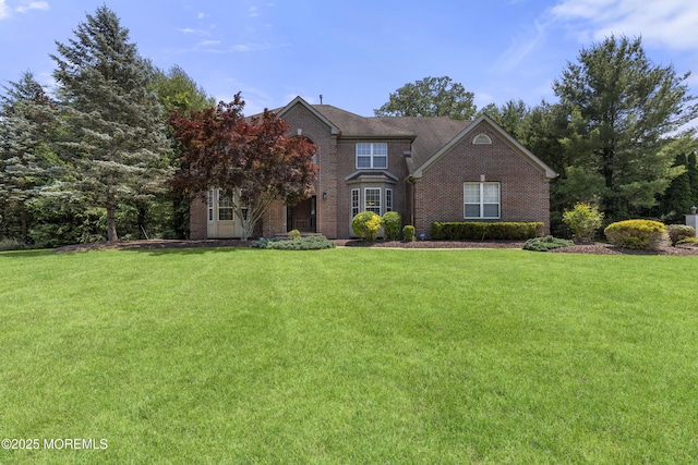 23 Emma Ln, Jackson, NJ 08527 - traditional-style home featuring brick siding and a front yard