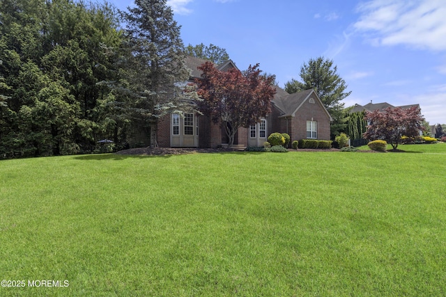 23 Emma Ln, Jackson, NJ 08527 - view of property hidden behind natural elements featuring a front yard and brick siding