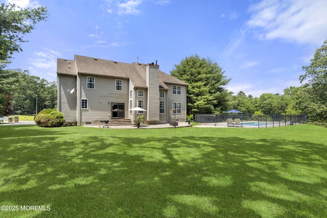 23 Emma Ln, Jackson, NJ 08527 - back of house featuring a patio area, a chimney, and a shingled roof