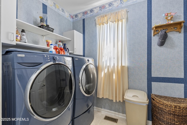 23 Emma Ln, Jackson, NJ 08527 - laundry area with wallpapered walls, washer and clothes dryer, and light tile patterned flooring