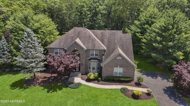 23 Emma Ln, Jackson, NJ 08527 - view of front facade featuring a front yard and brick siding