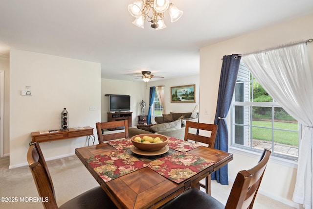 1 Maywood Run, Tinton Falls, NJ 07753 - dining room featuring light colored carpet, healthy amount of natural light, a chandelier, and a ceiling fan