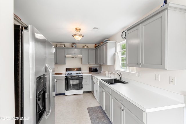 1 Maywood Run, Tinton Falls, NJ 07753 - kitchen with stainless steel appliances, gray cabinetry, under cabinet range hood, light countertops, and light floors