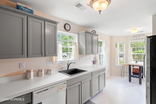 1 Maywood Run, Tinton Falls, NJ 07753 - kitchen with dishwasher, gray cabinets, freestanding refrigerator, and healthy amount of natural light