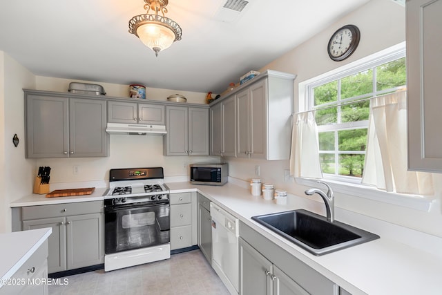 1 Maywood Run, Tinton Falls, NJ 07753 - kitchen with white appliances, gray cabinets, under cabinet range hood, and healthy amount of natural light