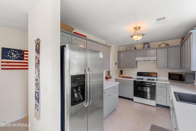 1 Maywood Run, Tinton Falls, NJ 07753 - kitchen featuring stainless steel appliances, gray cabinets, light countertops, and under cabinet range hood