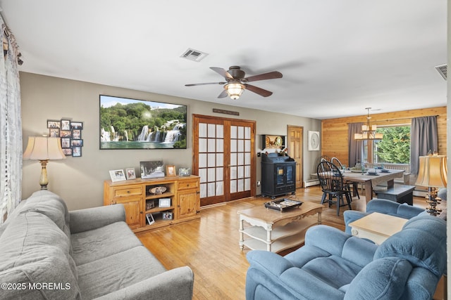 1172 Laurel Dr, Toms River, NJ 08753 - living area with light wood-style floors, ceiling fan, french doors, and a baseboard radiator