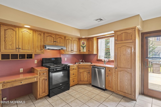 1172 Laurel Dr, Toms River, NJ 08753 - kitchen with black gas range, dishwasher, under cabinet range hood, and light countertops