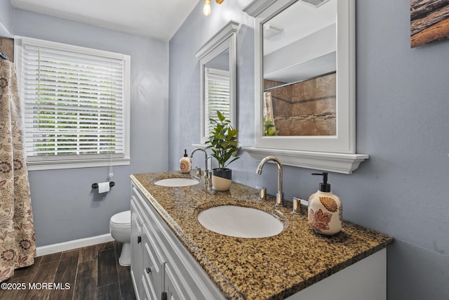1172 Laurel Dr, Toms River, NJ 08753 - bathroom with double vanity, wood finished floors, and a shower with curtain
