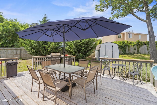 1172 Laurel Dr, Toms River, NJ 08753 - wooden deck with a storage shed, outdoor dining area, and a fenced backyard