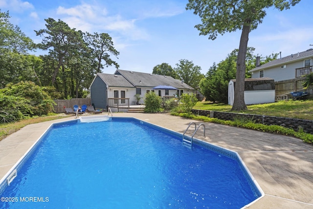 1172 Laurel Dr, Toms River, NJ 08753 - view of swimming pool featuring a wooden deck and a shed