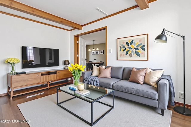 1172 Laurel Dr, Toms River, NJ 08753 - living room with beam ceiling, a chandelier, and wood finished floors