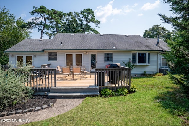 1172 Laurel Dr, Toms River, NJ 08753 - rear view of house featuring outdoor dining area, a yard, a shingled roof, and a wooden deck