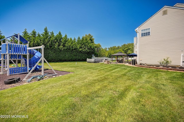 201 Manfre Ct, Freehold, NJ 07728 - view of green lawn featuring a gazebo and a playground