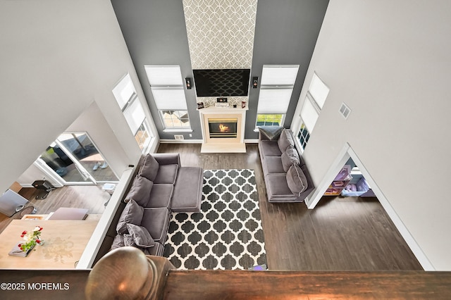 201 Manfre Ct, Freehold, NJ 07728 - living area with a high ceiling, wood finished floors, a glass covered fireplace, and baseboards
