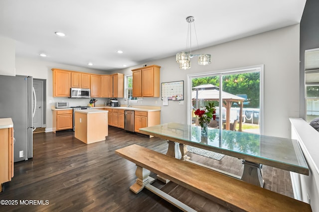 201 Manfre Ct, Freehold, NJ 07728 - kitchen featuring appliances with stainless steel finishes, light countertops, a center island, dark wood-style flooring, and recessed lighting
