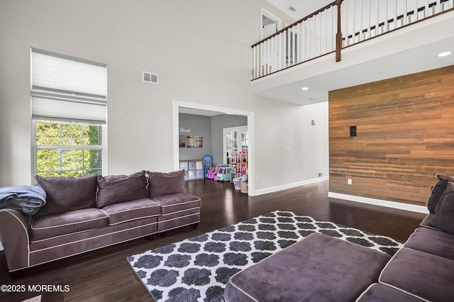201 Manfre Ct, Freehold, NJ 07728 - living area featuring wood finished floors, healthy amount of natural light, baseboards, a towering ceiling, and wooden walls