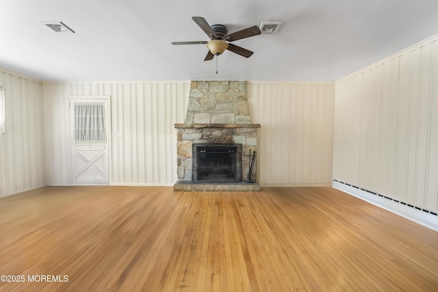 96 Gordons Corner Rd, Manalapan, NJ 07726 - unfurnished living room with a ceiling fan, a fireplace, wood finished floors, and a baseboard heating unit