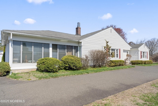 96 Gordons Corner Rd, Manalapan, NJ 07726 - view of home's exterior featuring a chimney