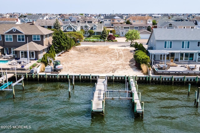 275 Curtis Point Dr, Mantoloking, NJ 08738 - dock area with boat lift, a residential view, and a water view