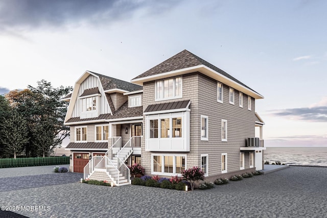 275 Curtis Point Dr, Mantoloking, NJ 08738 - shingle-style home featuring a standing seam roof, a garage, roof with shingles, stairs, and central AC