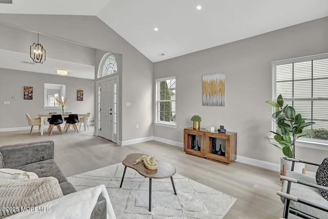 6 Isabella Dr, Manchester, NJ 08759 - living area featuring light wood finished floors, high vaulted ceiling, recessed lighting, baseboards, and a chandelier
