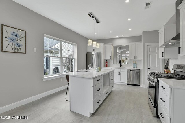 6 Isabella Dr, Manchester, NJ 08759 - kitchen with stainless steel appliances, a sink, white cabinets, and recessed lighting