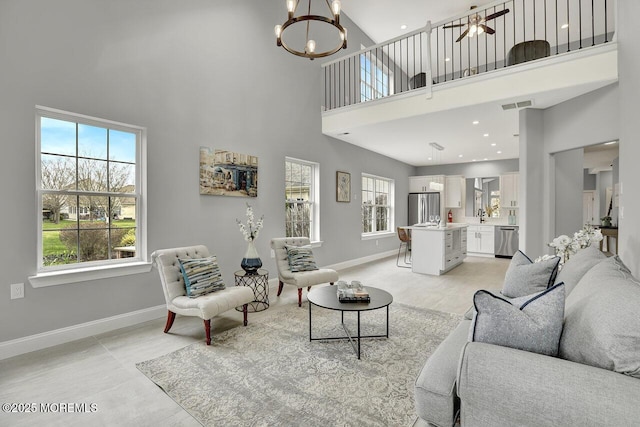 6 Isabella Dr, Manchester, NJ 08759 - living room with a towering ceiling, baseboards, and a chandelier