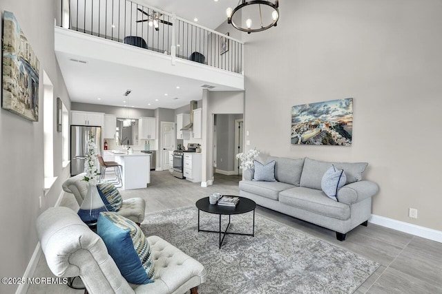 6 Isabella Dr, Manchester, NJ 08759 - living room featuring a chandelier, baseboards, a high ceiling, and recessed lighting