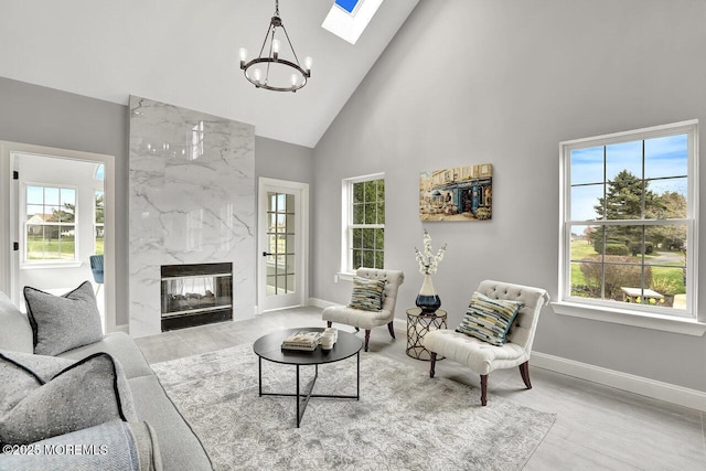 6 Isabella Dr, Manchester, NJ 08759 - living room featuring a chandelier, high vaulted ceiling, healthy amount of natural light, and baseboards