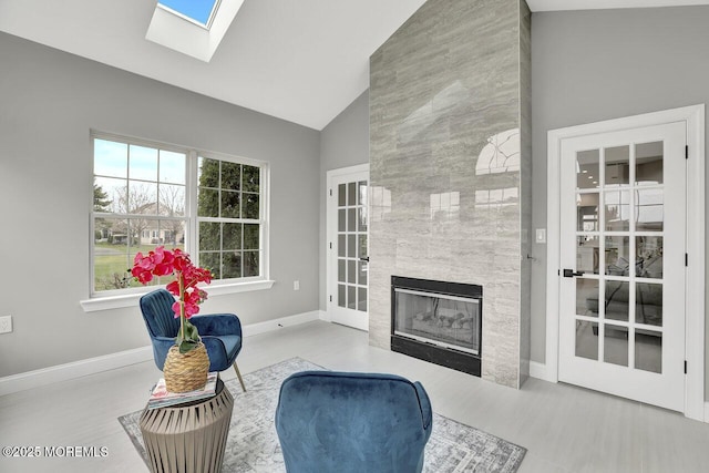 6 Isabella Dr, Manchester, NJ 08759 - living room with a skylight, a tile fireplace, baseboards, and high vaulted ceiling
