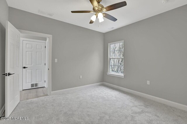 6 Isabella Dr, Manchester, NJ 08759 - carpeted spare room with baseboards and a ceiling fan