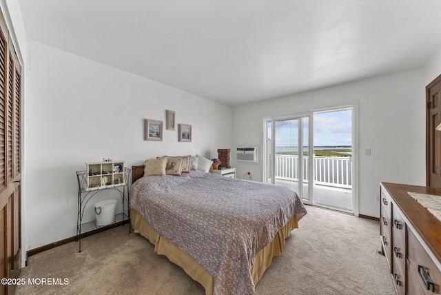 100 Seaview Ave Unit 4-12, Monmouth Beach, NJ 07750 - bedroom with access to exterior, light carpet, a wall unit AC, baseboards, and a water view