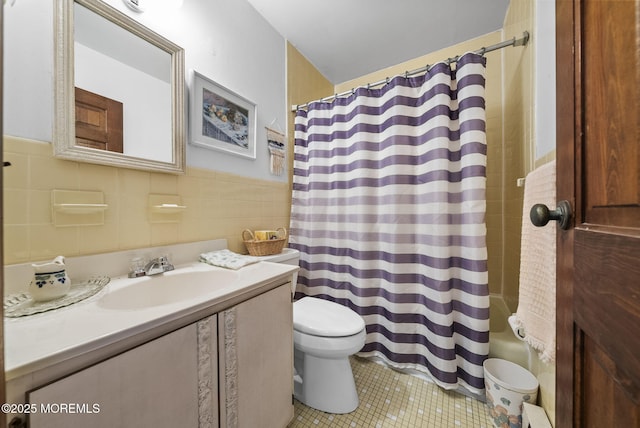 100 Seaview Ave Unit 4-12, Monmouth Beach, NJ 07750 - bathroom with toilet, vanity, tile patterned flooring, tile walls, and a wainscoted wall