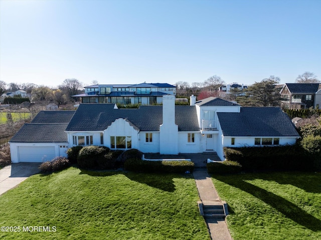58 Ocean Ave, Deal, NJ 07723 - view of front of home featuring driveway, a front yard, and a chimney