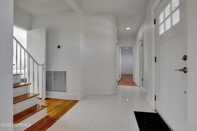 58 Ocean Ave, Deal, NJ 07723 - tiled entrance foyer with stairway, baseboards, and recessed lighting