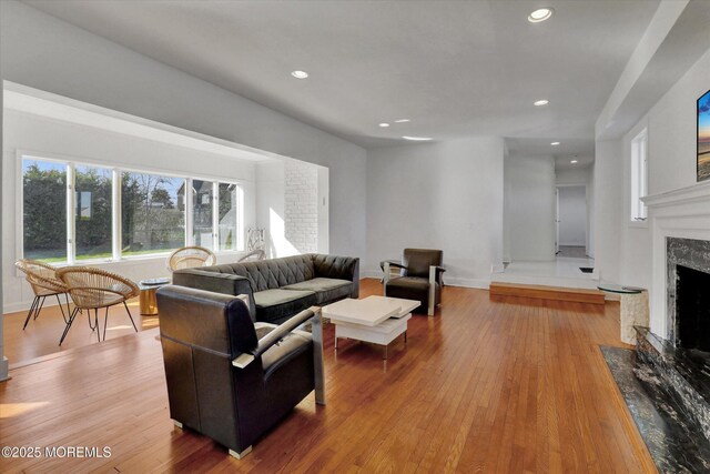 58 Ocean Ave, Deal, NJ 07723 - living room with a premium fireplace, wood finished floors, recessed lighting, and baseboards
