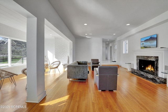 58 Ocean Ave, Deal, NJ 07723 - living room with a premium fireplace, light wood-style flooring, plenty of natural light, and recessed lighting