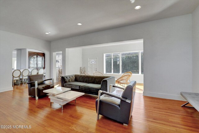 58 Ocean Ave, Deal, NJ 07723 - living room featuring wood finished floors, arched walkways, plenty of natural light, recessed lighting, and baseboards