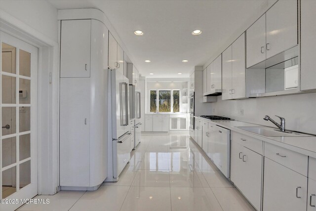 58 Ocean Ave, Deal, NJ 07723 - kitchen featuring a sink, white dishwasher, high quality fridge, under cabinet range hood, and recessed lighting