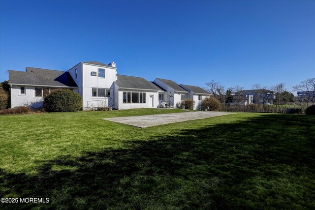 58 Ocean Ave, Deal, NJ 07723 - rear view of property with a patio area and a chimney