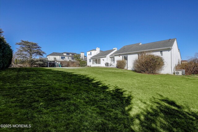 58 Ocean Ave, Deal, NJ 07723 - back of property featuring a yard and a cooling unit