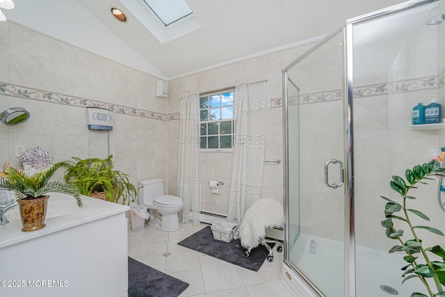 6 Quid Pl, Manalapan, NJ 07726 - bathroom featuring tile patterned flooring, a skylight, tile walls, vaulted ceiling, and a shower stall