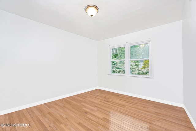 6 Quid Pl, Manalapan, NJ 07726 - empty room with baseboards and light wood-style flooring