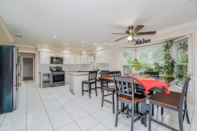 6 Quid Pl, Manalapan, NJ 07726 - dining room with wine cooler, ceiling fan, crown molding, and light tile patterned floors