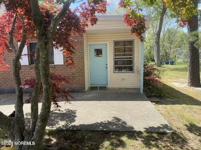 10 Hemlock St Unit D, Toms River, NJ 08757 - property entrance with brick siding and a lawn