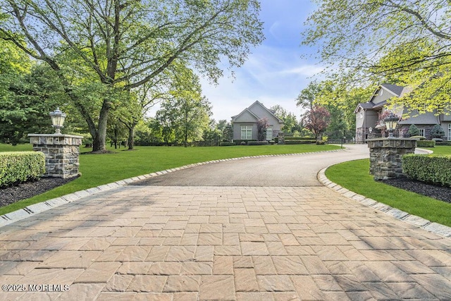 23 Pilgrim Way, Colts Neck, NJ 07722 - view of front of home featuring curved driveway and a front yard